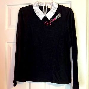 Long sleeve black shirt with collar.